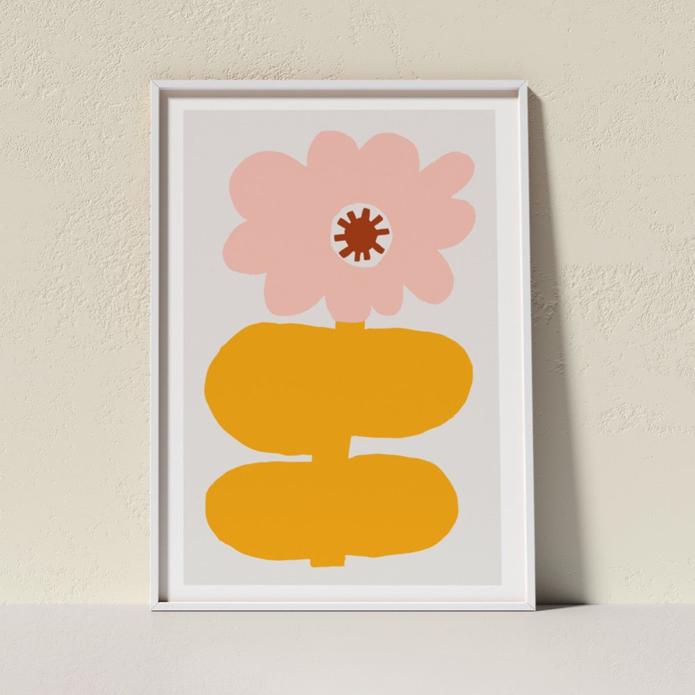A colourful Giclée Art Print featuring a cloud-like pink petaled flower with a dark red center, held up by an egg yolk yellow stem and thick, sturdy leaves. A happy addition to any space.